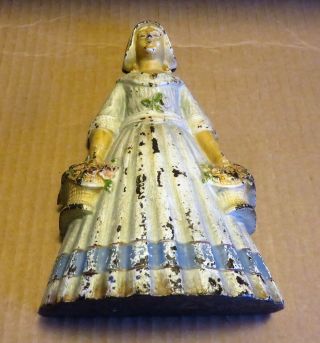 Antique Cast Iron Door Stop - Dutch Woman With Flowers - Signed D270 - Blue